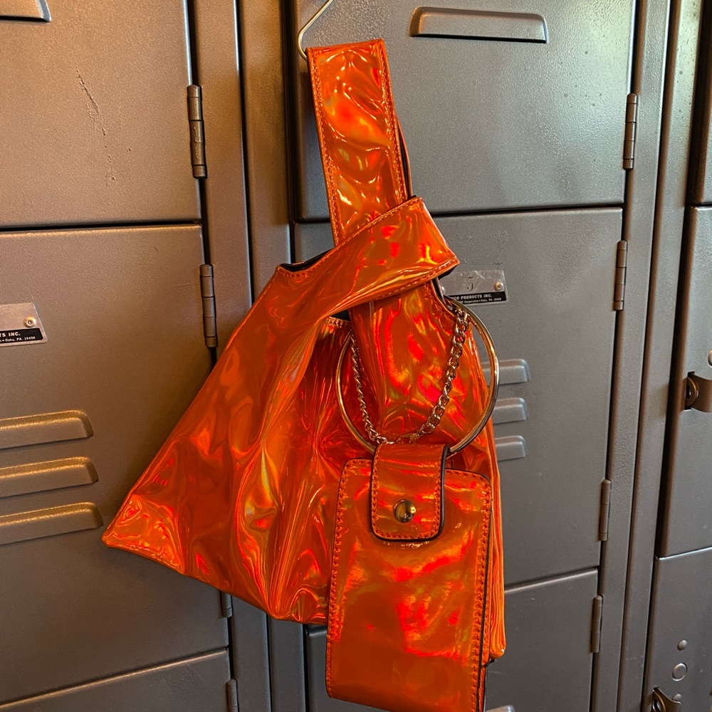 Bright metallic orange wristlet tote